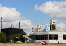 Areál Výstaviště s Křižíkovými pavilony A–D, objekty Pyramida a Spirála navrhl architekt Michal Brix. Na konstrukčním řešení se podílel Karel Jerie, návrh ocelové konstrukce zpracoval Arnošt Pryl. Ocelové konstrukce realizovaly společnosti Mostárna Moravský Krumlov a HUTNÍ MONTÁŽE, a.s., prováděcí projekt a dodávku zajistil Armabeton Praha. Projekt vznikl v srpnu 1990, realizace probíhala v letech 1990–1999.
